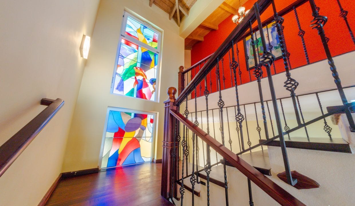 For Sale Enormous Villa Steps To The Ocean Dominican Republic Image of staircase with stained glass feature