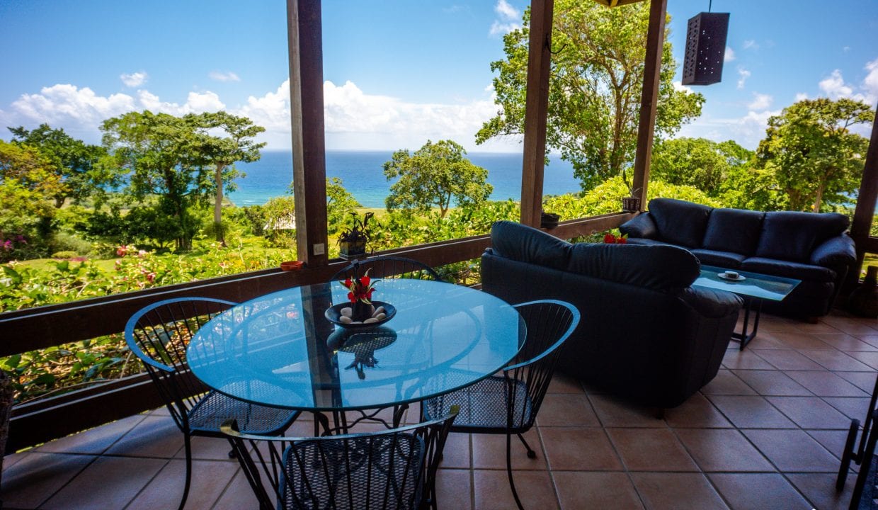 Image of For Sale Listing “Estate of Mind” Luxurious and Graceful Villa sunroom with ocean view