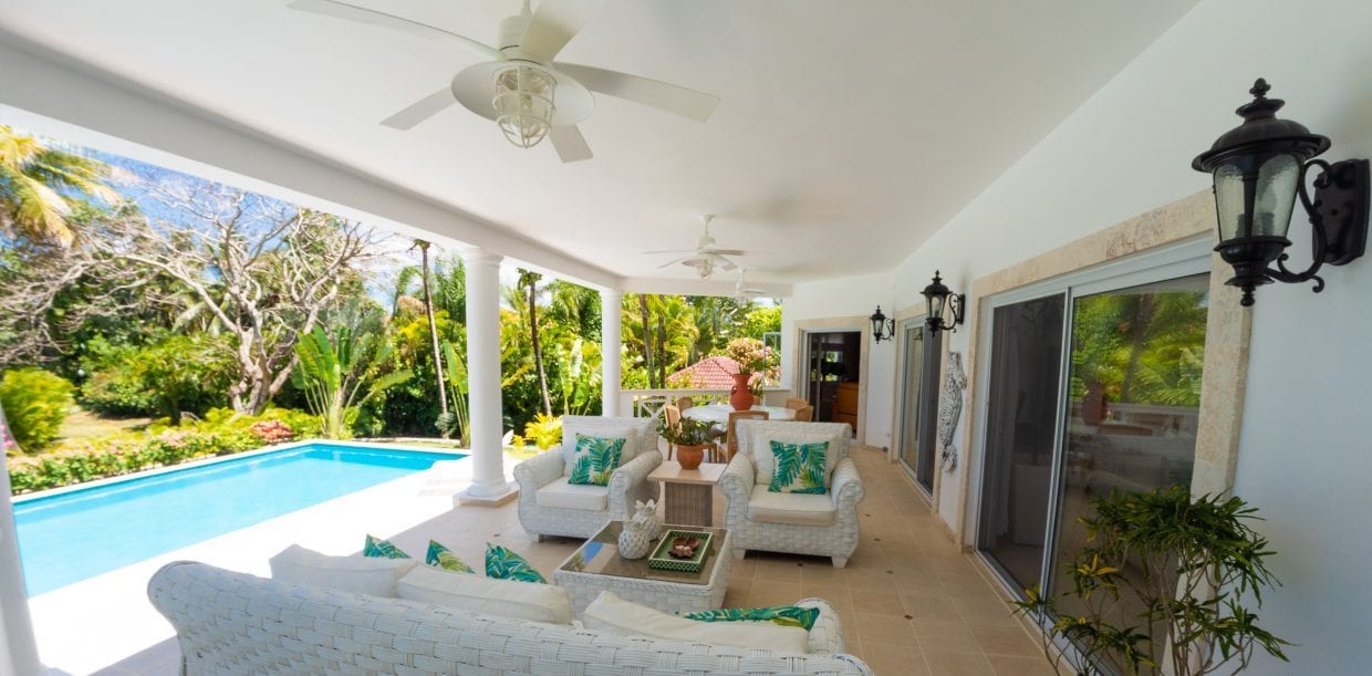 For Sale Villa Royale Coastal Luxury Home Dominican Republic Image of terrace with seating and pool view
