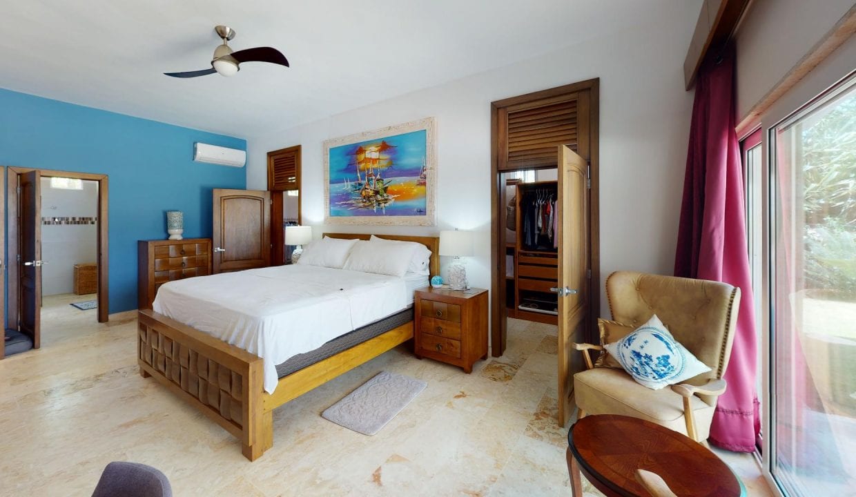 Spectacular Beachfront Villa image of master bedroom walk-in closet and seating