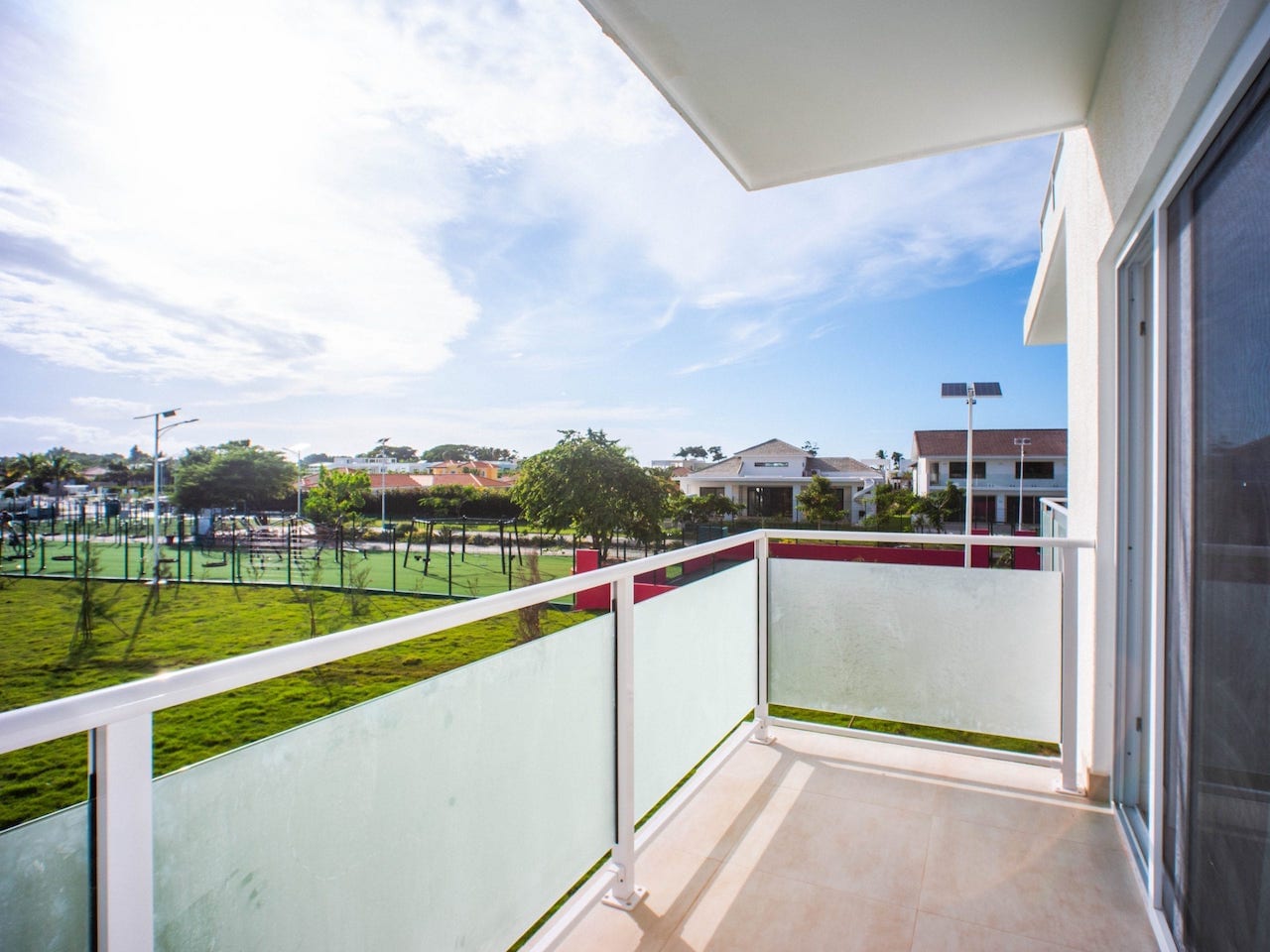 Furnished Studio In Coastal Gated Community balcony view of green space