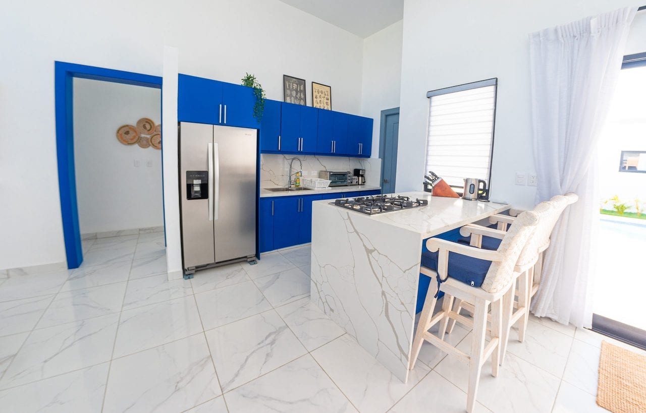 SOV Fully Furnished Villa In Top Gated Community interior blue cabinet kitchen