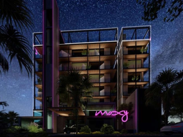 M Suites Costa Norte exterior at night