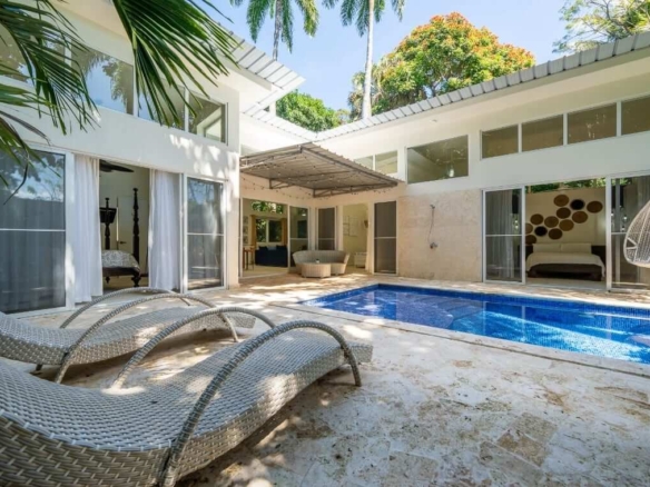 Charming Modern 3-Bedroom Villa poolside loungers