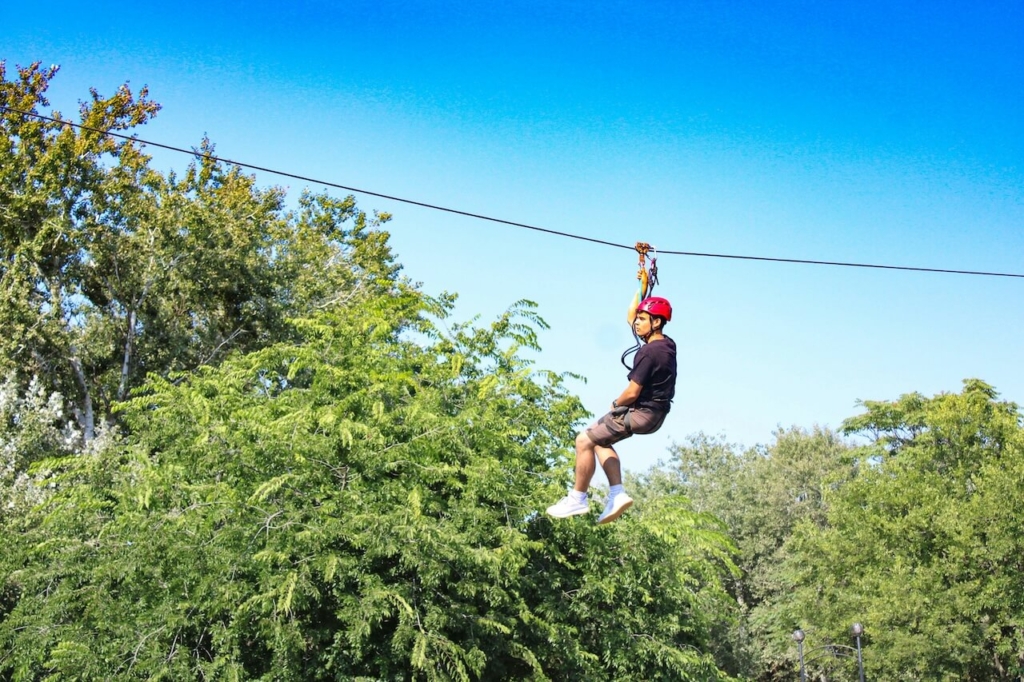Person ziplining team building business excursions in Punta Cana